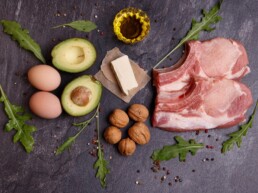 sources of healthy fats like eggs, avocados, cheese, nuts, olive oil