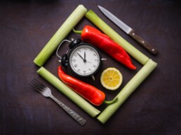Intermittent fasting clock on chopping board